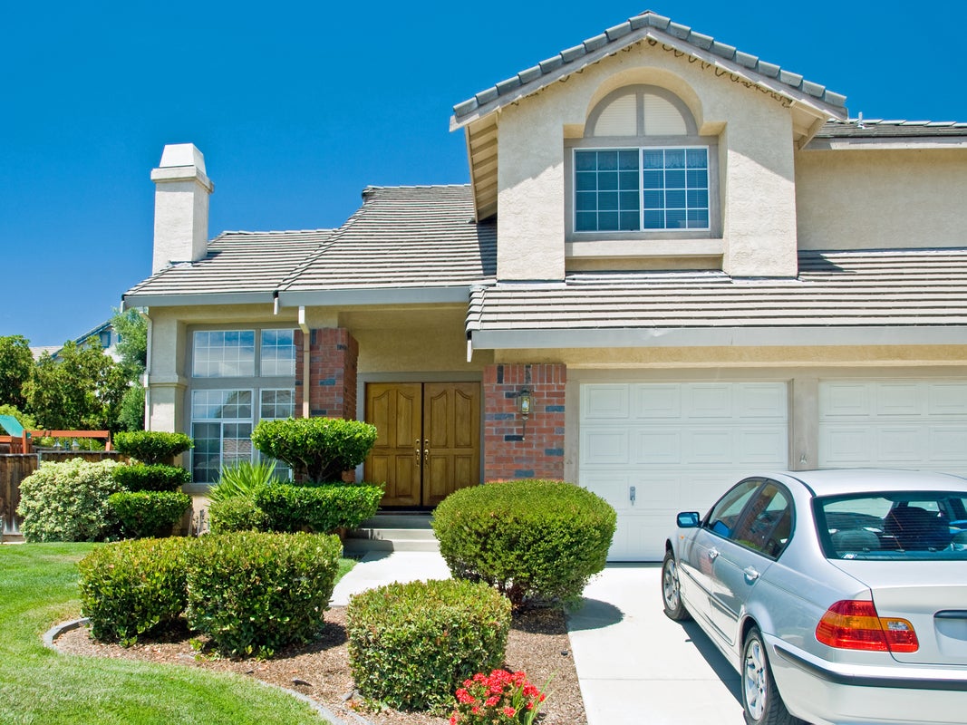 a car parked in front of a house