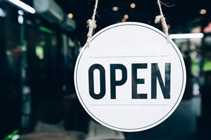 open sign hanging on business door