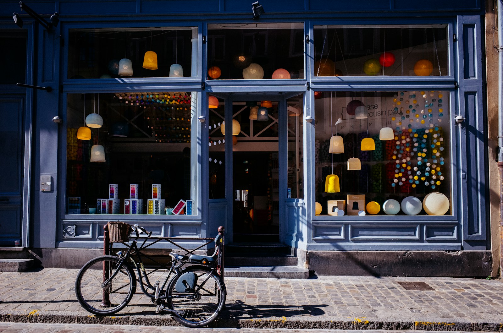 black bike parked near storefront